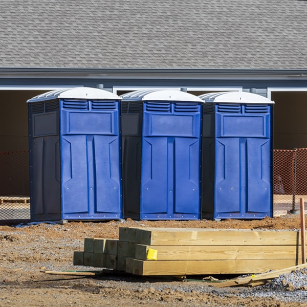 what is the cost difference between standard and deluxe portable toilet rentals in South Komelik